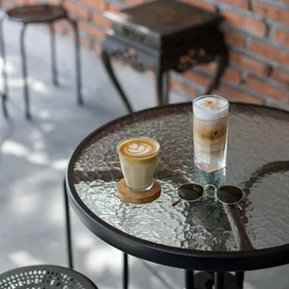 A cafe table set with lattes for a first date